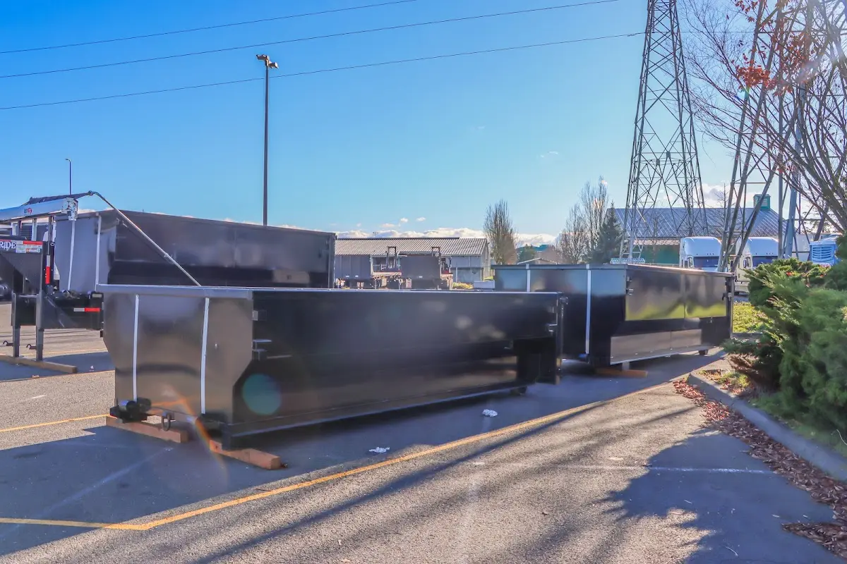 Roll-off dumpster ready for waste disposal at job site for Concrete Dumpster Rental in Fort Rucker